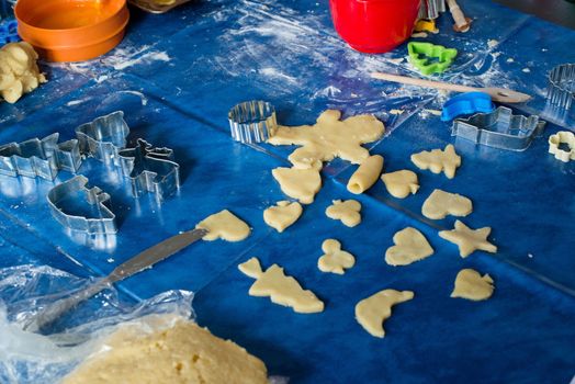 Details of child's workplace cutting Christmas cookies
