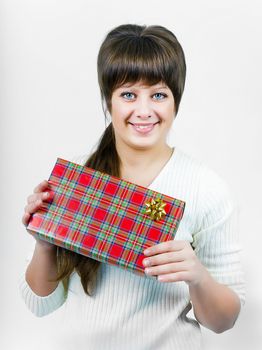 beautiful blue eyed young happy smiling girl with a gift box