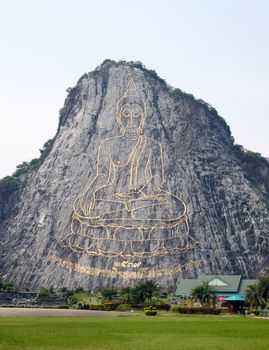 130 mtr high golden Buddha laser carved and inlayed with gold on Khao Chee Chan cliff Sattahip Thailand