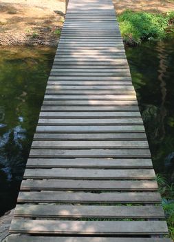 wooden walkway path on stream
