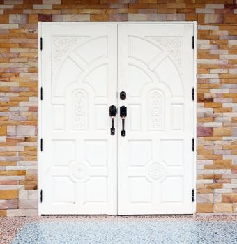 white wooden texuture door on brick wall background