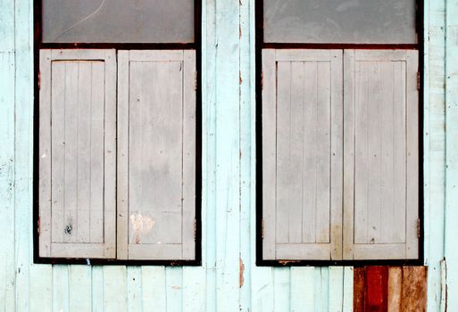 two wooden window on wooden wall background