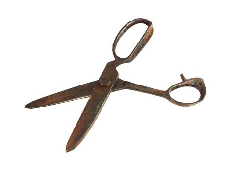 Old rusty sewing scissors isolated on white