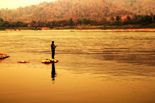 Man fishing in Mekong river at Loei, Thailand