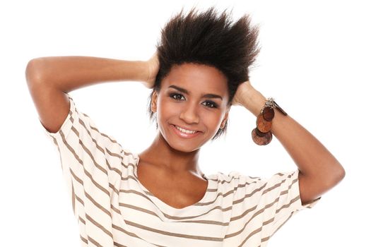 Young smiling black woman in studio isolated on a white