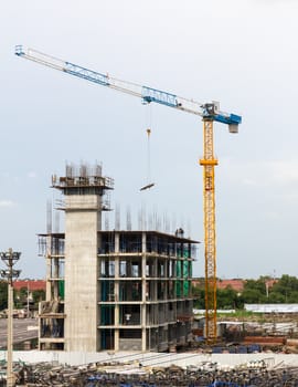 Construction crane and building in construction site