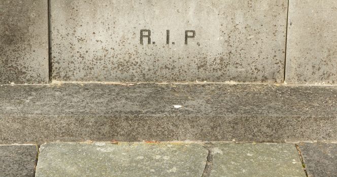 The letters RIP (Rest In Peace) on an old grave in Holland