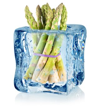 Ice cube and asparagus isolated on a white background