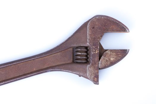 An old rusty vector wrench on a white background