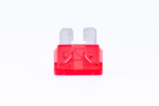 A red car fuse with a white background