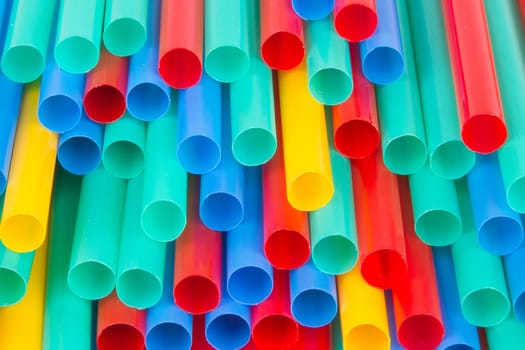 Different colors of straws (green, blue, yellow, red)