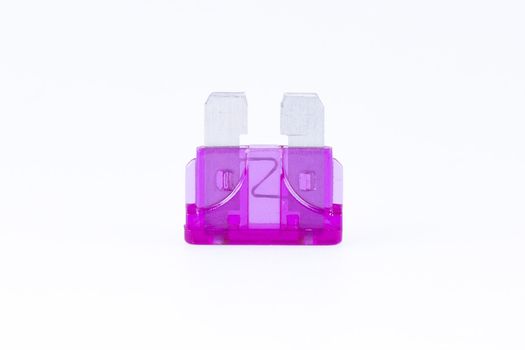 A purple car fuse with a white background