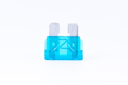 A blue car fuse with a white background