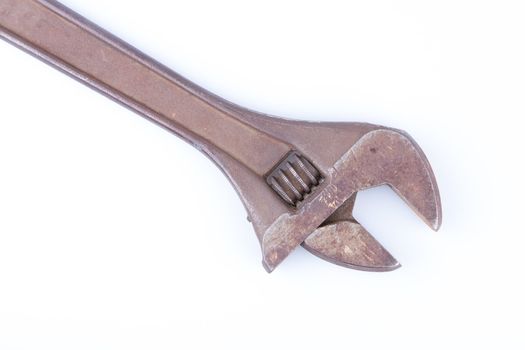 An old rusty vector wrench on a white background