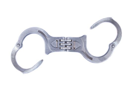 Metal handcuffs isolated on a white background