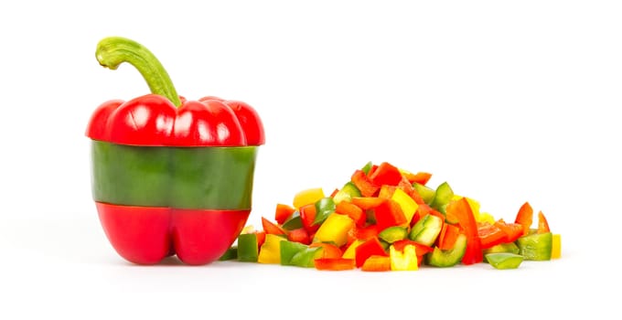 A sliced red and green pepper on a white background