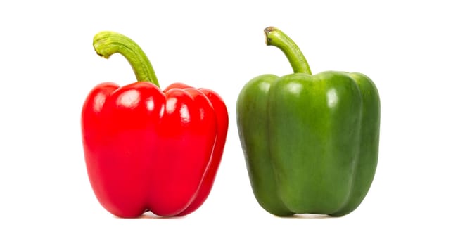 Green and red pepper isolated on a white background