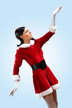 Santa Girl presenting your product, in costume and white gloves