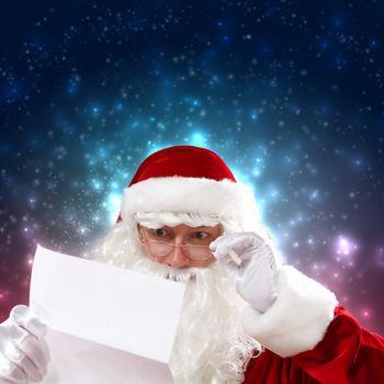 Santa holding Christmas letters and looking at camera