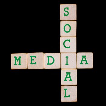 Social media spelled in a crossword on a black background