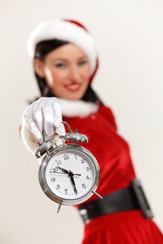 excited girl with santa hat holding clock. illustration