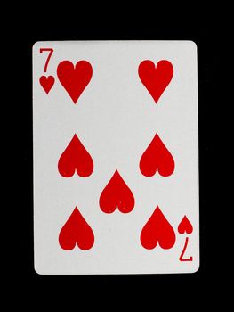 Playing card (seven) isolated on a black background