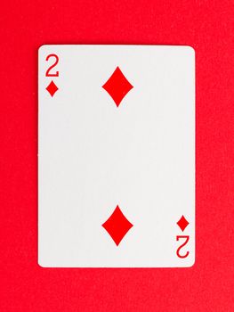 Playing card (two) isolated on a red background