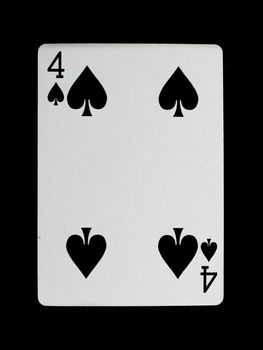 Old playing card (four) isolated on a black background