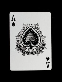 Old playing card (ace) isolated on a black background