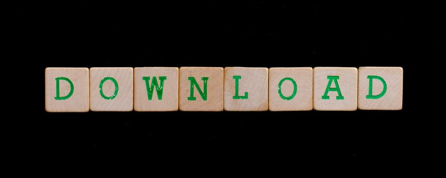 Green letters on old wooden blocks (download)