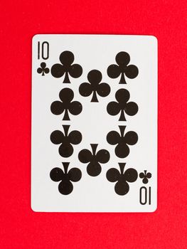 Old playing card (ten) isolated on a red background