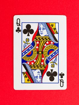 Old playing card (queen) isolated on a red background