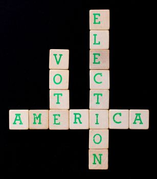 Letters on wooden blocks (America, vote, election)