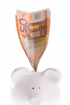 Saving fifty euro in a white money box