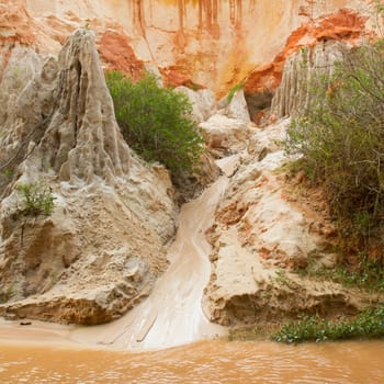 Ham Tien canyon in Vietnam, small stream carving through the sand