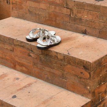 Shoes at the old entrance of a mosque