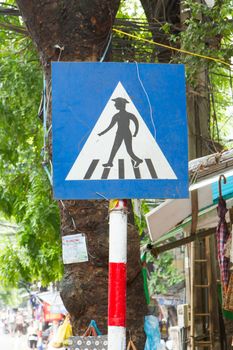 Pedestrian crossing sign in the center of Hanoi (Vietnam)