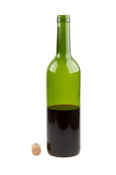 Half empty red wine bottle isolated on white