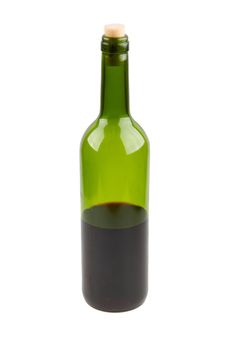 Half empty red wine bottle isolated on white