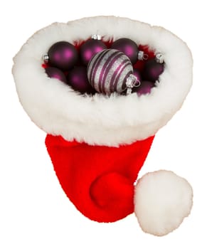 Santas hat filled with Christmas purple balls