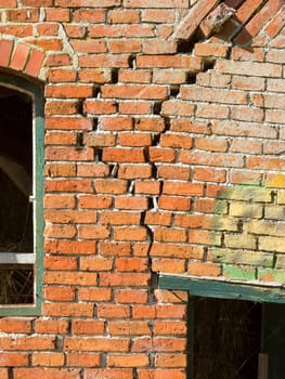 Close-up of a broken (cracked) old brick wall