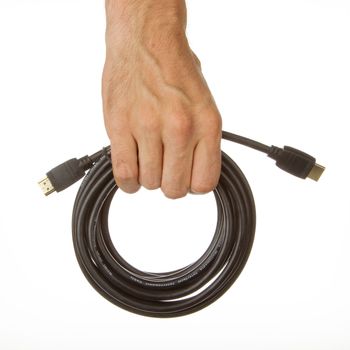 Close-up of hdmi cable in a hand on white background