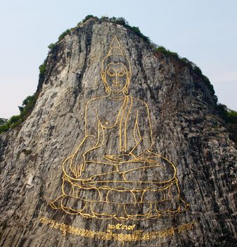 130 mtr high golden Buddha laser carved and inlayed with gold on Khao Chee Chan cliff Sattahip Thailand
