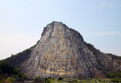 130 mtr high golden Buddha laser carved and inlayed with gold on Khao Chee Chan cliff Sattahip Thailand