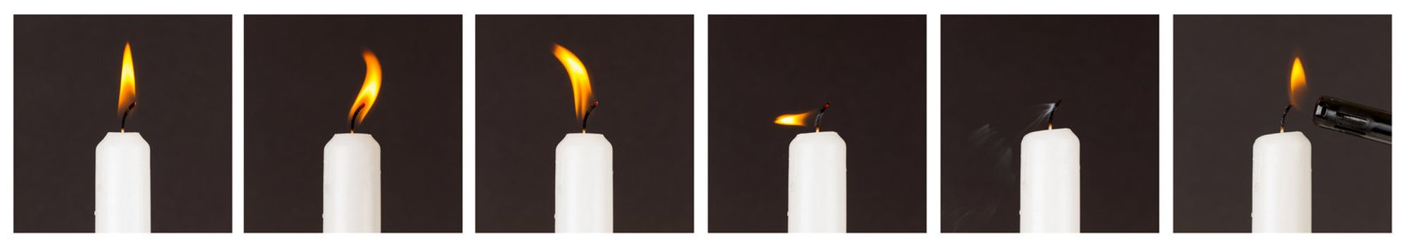 White candle isolated against a black background