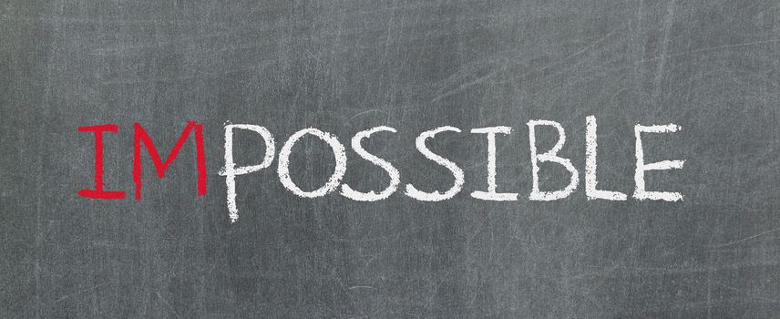 Possible and impossible written on a blackboard