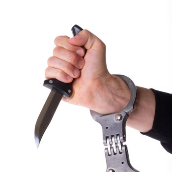 Male with a sharp knife in it's hand with a handcuff