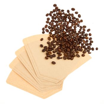 Coffee beans on a coffee filter (white background)