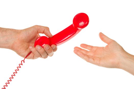 Man giving an old red telephone to a woman