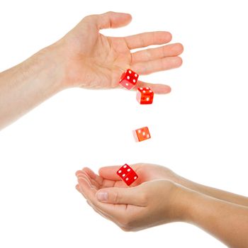 Five red dice being thrown from a hand, man to woman